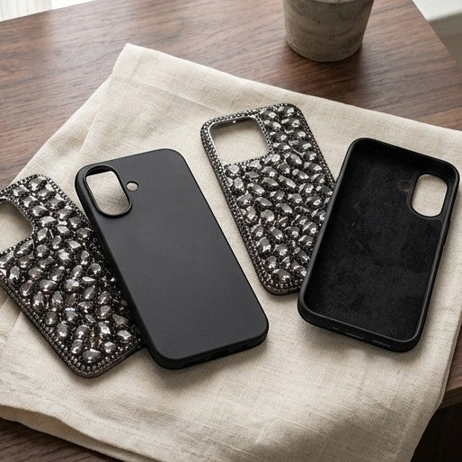 digitaley.co black phone case with rhinestone embellishments and a plain black slim case.