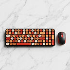 digitaley.co Sunset Glow retro wireless keyboard and mouse set with round, typewriter-style keycaps in orange, cream, and red.