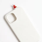 digitaley.co white iPhone case with a 3D miniature Turkish tea glass and saucer accessory.