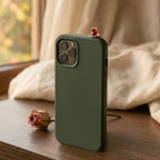 digitaley.co dark green phone case with a miniature Turkish tea cup and saucer accessory on top, with steam effect.