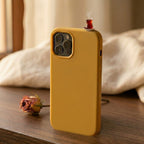 digitaley.co mustard yellow silicone iPhone case with a miniature tea glass motif on top. Features camera cutout.