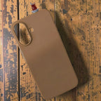 digitaley.co brown silicone iPhone case with a 3D tea glass motif on top.