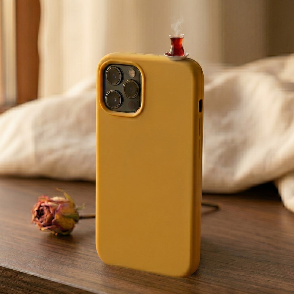 digitaley.co mustard yellow phone case with a miniature Turkish tea cup and saucer accessory