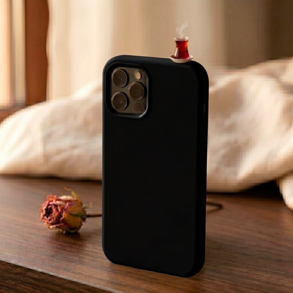 digitaley.co mustard yellow silicone iPhone case with a miniature steaming tea glass motif on top. Slim-waist design.