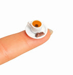 digitaley.co 3D miniature Turkish coffee cup and chocolate on a white saucer, realistic detail.