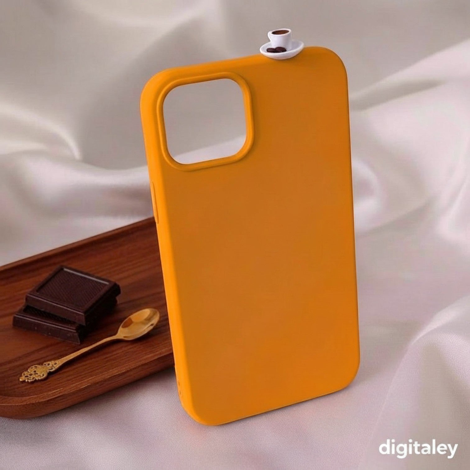 Orange 3D phone case with miniature Turkish coffee cup and beans on top. Digitaley.co accessory.
