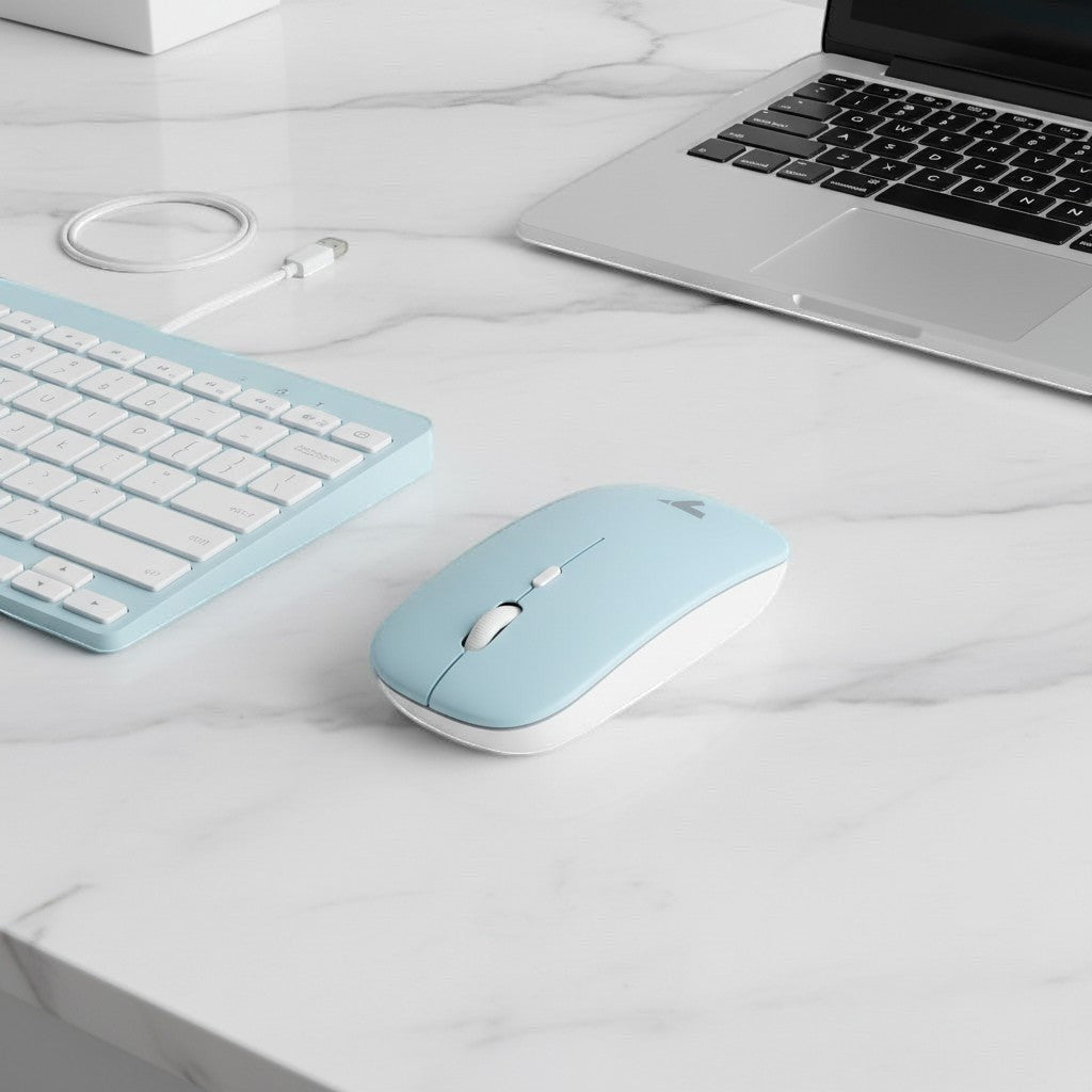 digitaley.co pastel blue wireless keyboard and mouse set with white keys and scroll wheel on a marble desk.