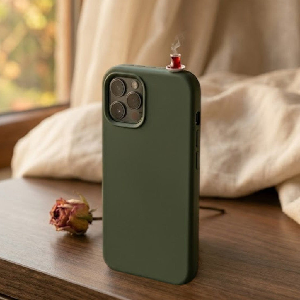 digitaley.co dark green silicone iPhone case with a miniature tea glass motif on top. Features a slim-waist design.