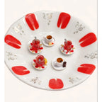 Handmade miniature Turkish tea set phone case accessory with tiny tea cups, saucers, sugar cubes, and lemon slice on a decorative plate.