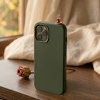 digitaley.co dark green silicone iPhone case with a miniature tea glass motif on top. Features a slim-waist design.